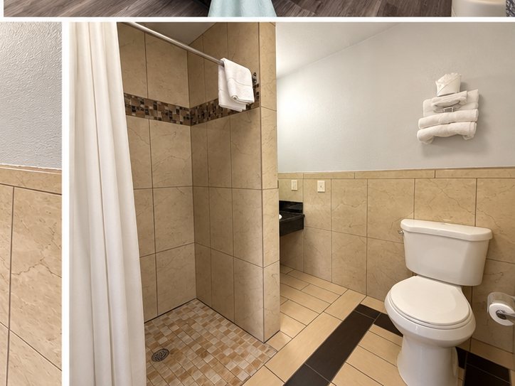 Tiled bathroom with a walk-in shower and folded towels